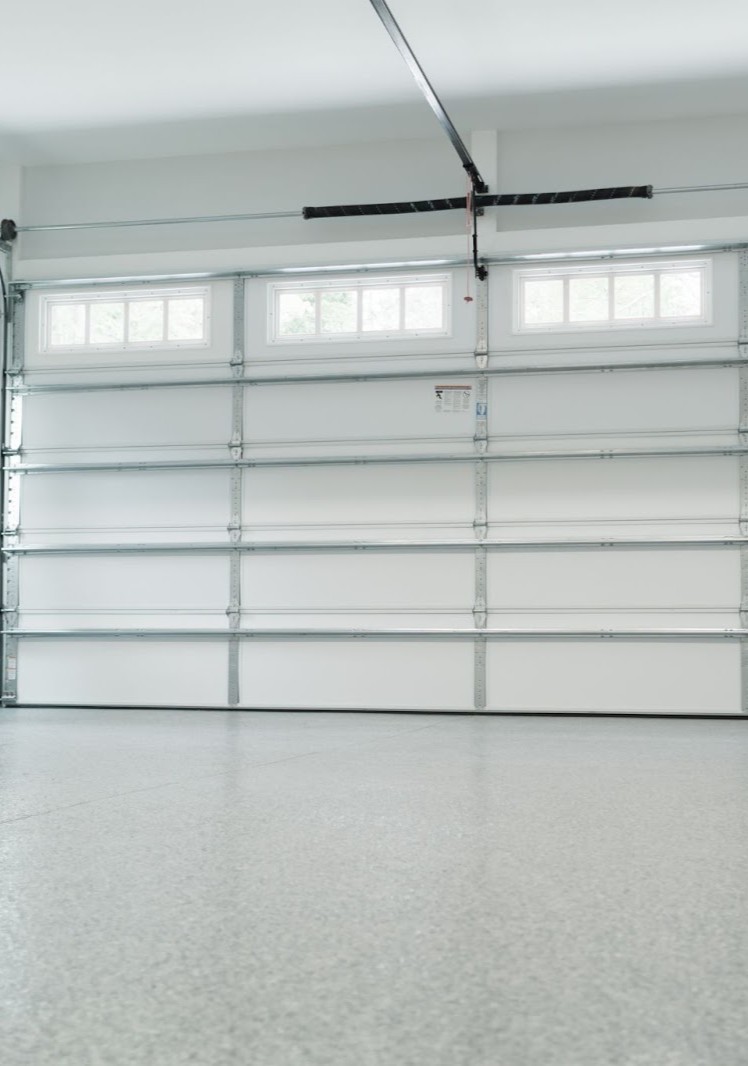 Garage door opener being repaired by a professional