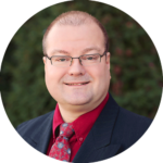 Technician performing garage door spring repair in Dallas